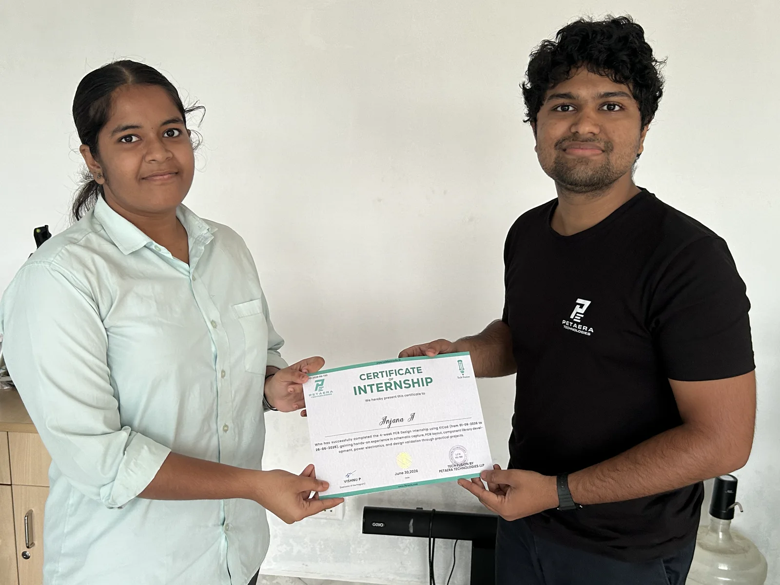 A student receiving recognition for completing the 2026 internship